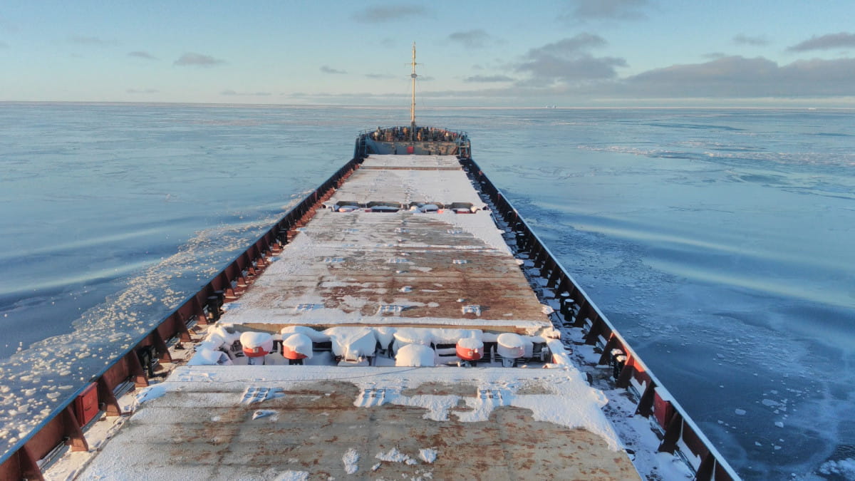 Commercial vessel navigating Arctic sea ice