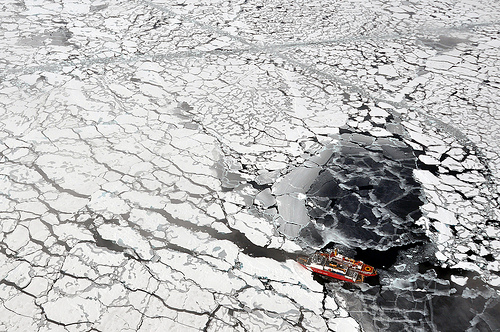 Icebreaker sailing through arctic sea ice