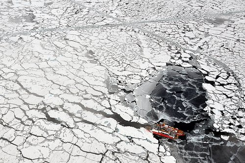 Icebreaker sailing through arctic sea ice